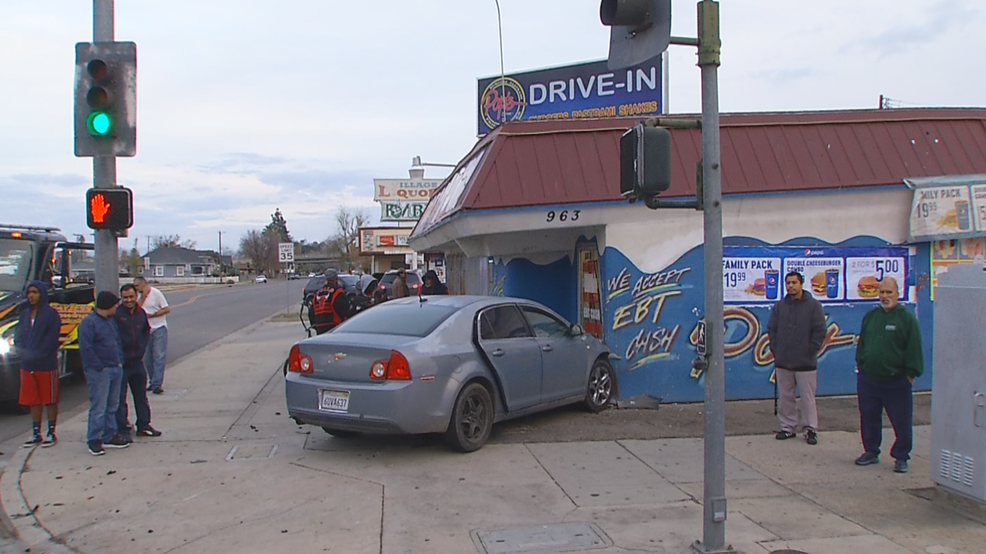 Car crashes into burger spot during traffic accident in east