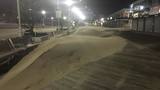 Rough weather leaves sand dunes on Ocean City Boardwalk ahead of Florence