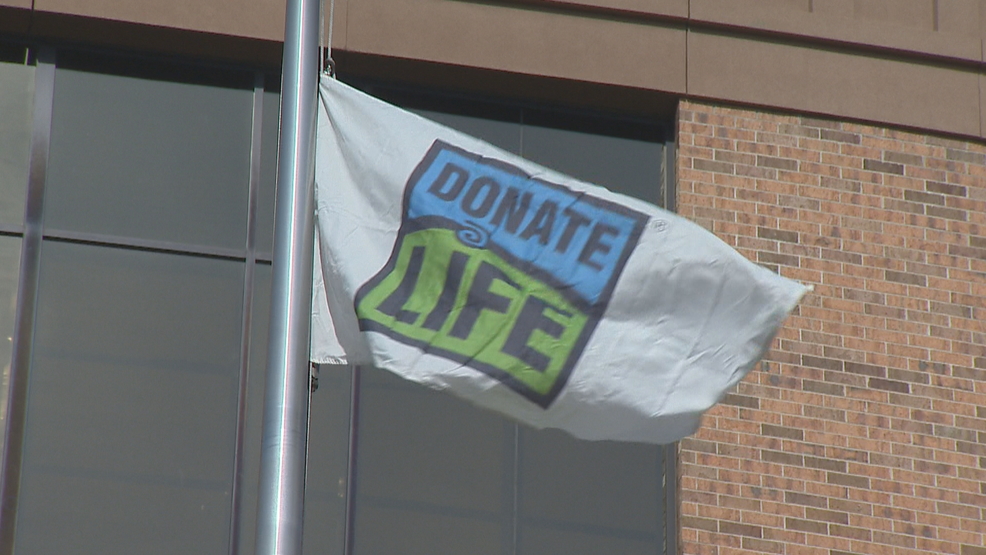 a flag raising ceremony held at bellin health in green bay